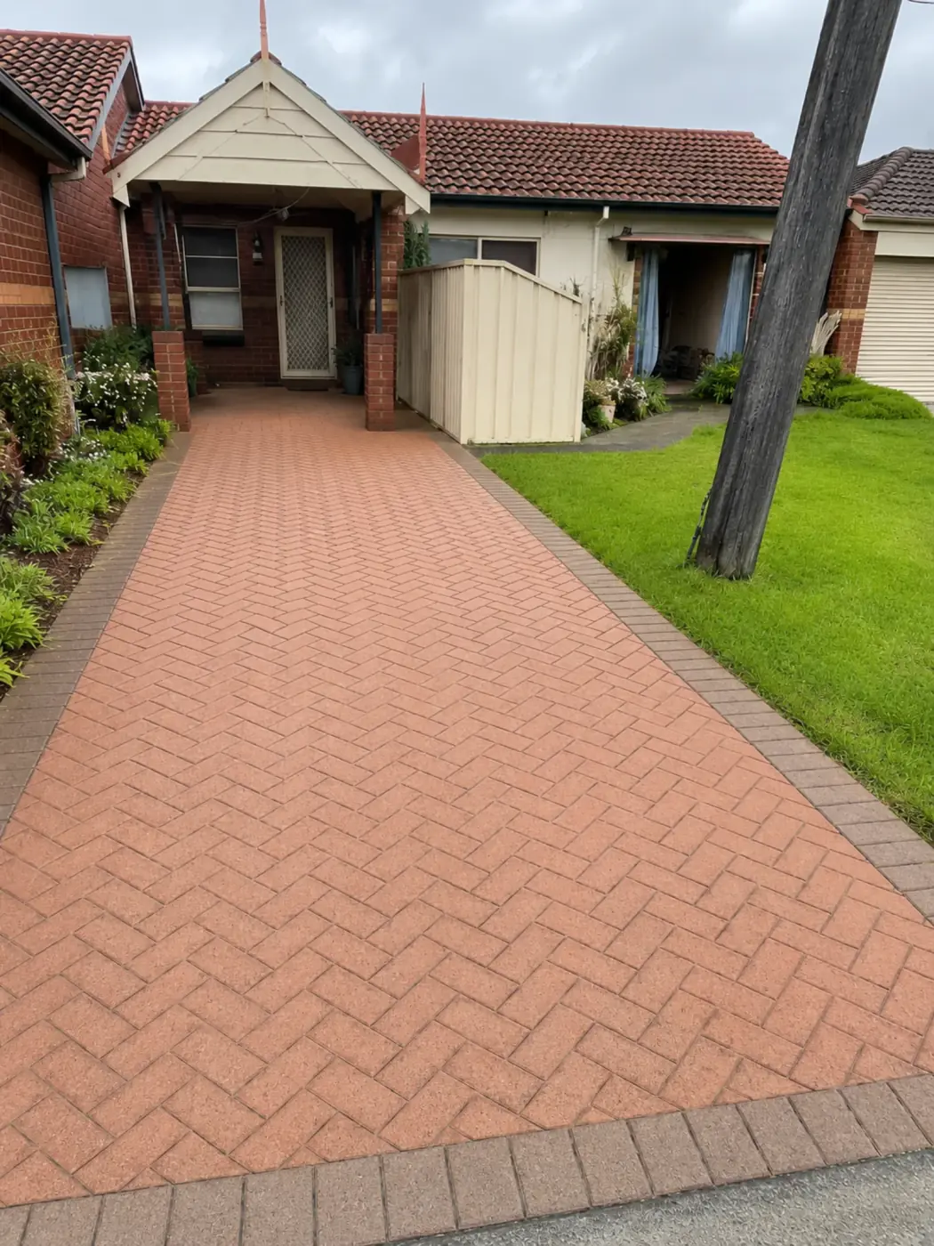 Clean driveway surface after pressure washing