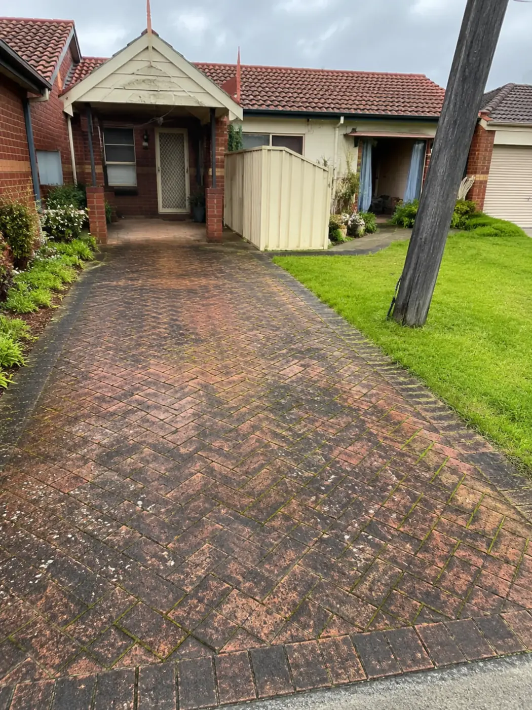 Dirty driveway surface before pressure washing