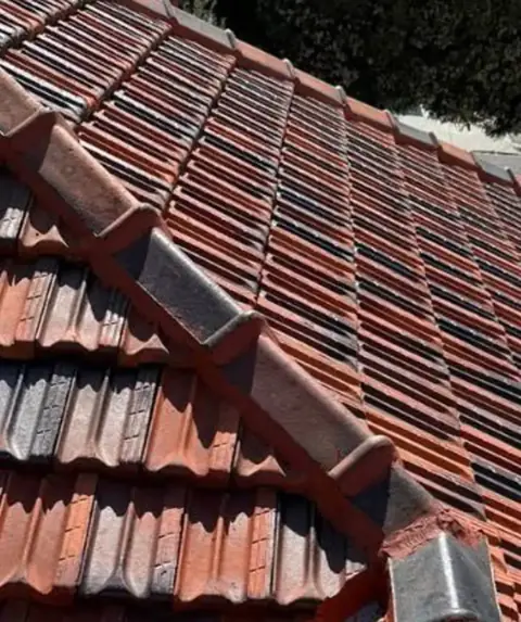Roof after restoration — refreshed tile finish